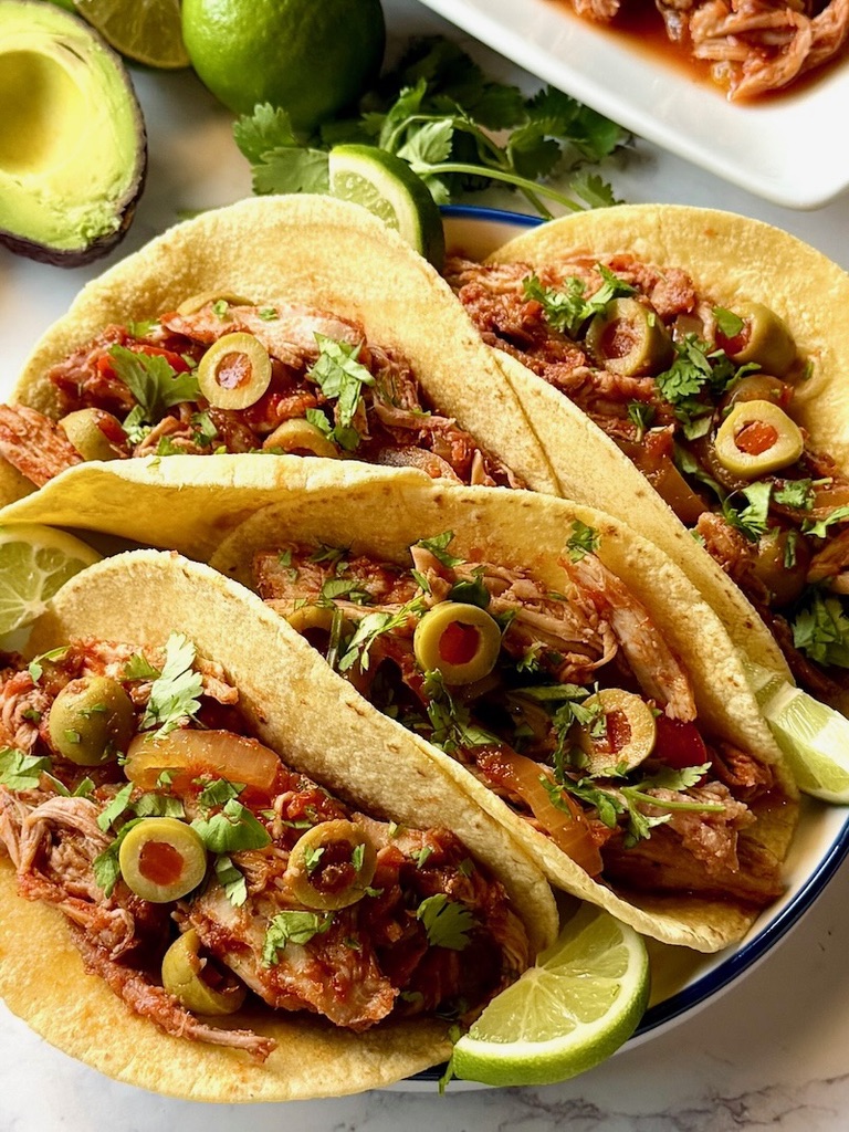 Spanish pulled pork shredded in tacos. 