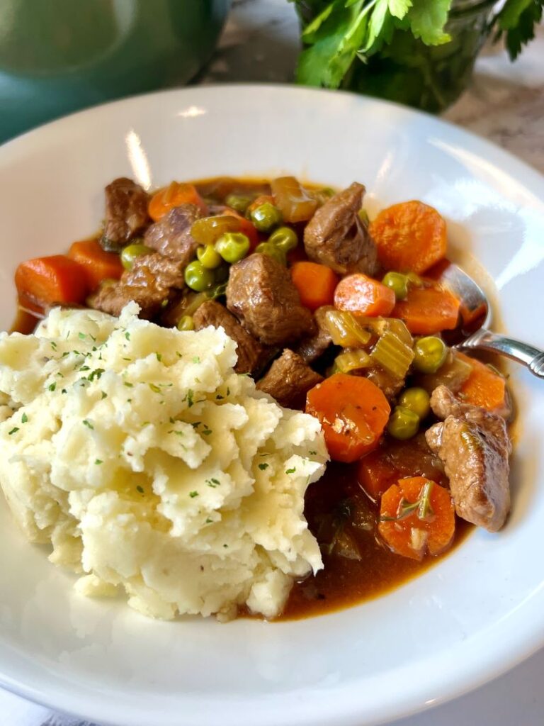 Guinness Irish Beef Stew Over Creamy Mashed Potatoes