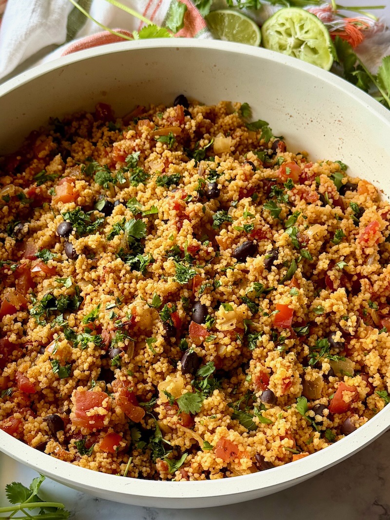 Mexican couscous cooked and garnished with cilantro and lime juice. 