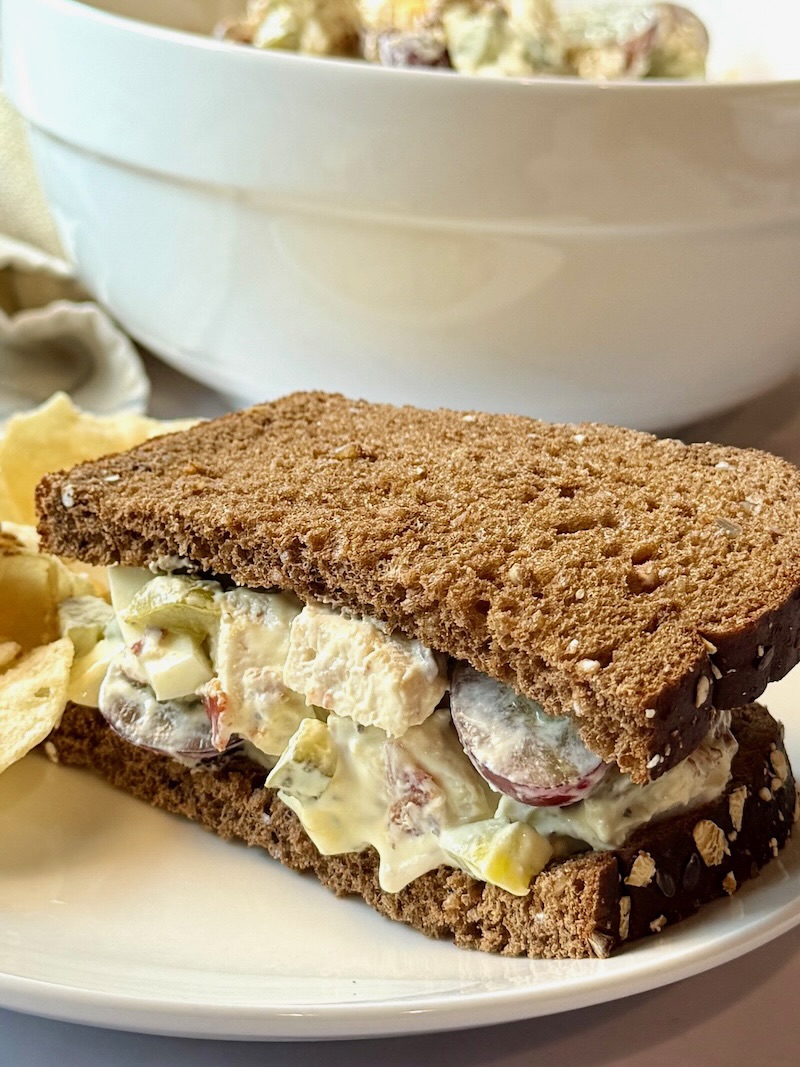 Easy chicken salad with bacon in between whole-grain bread slices. 