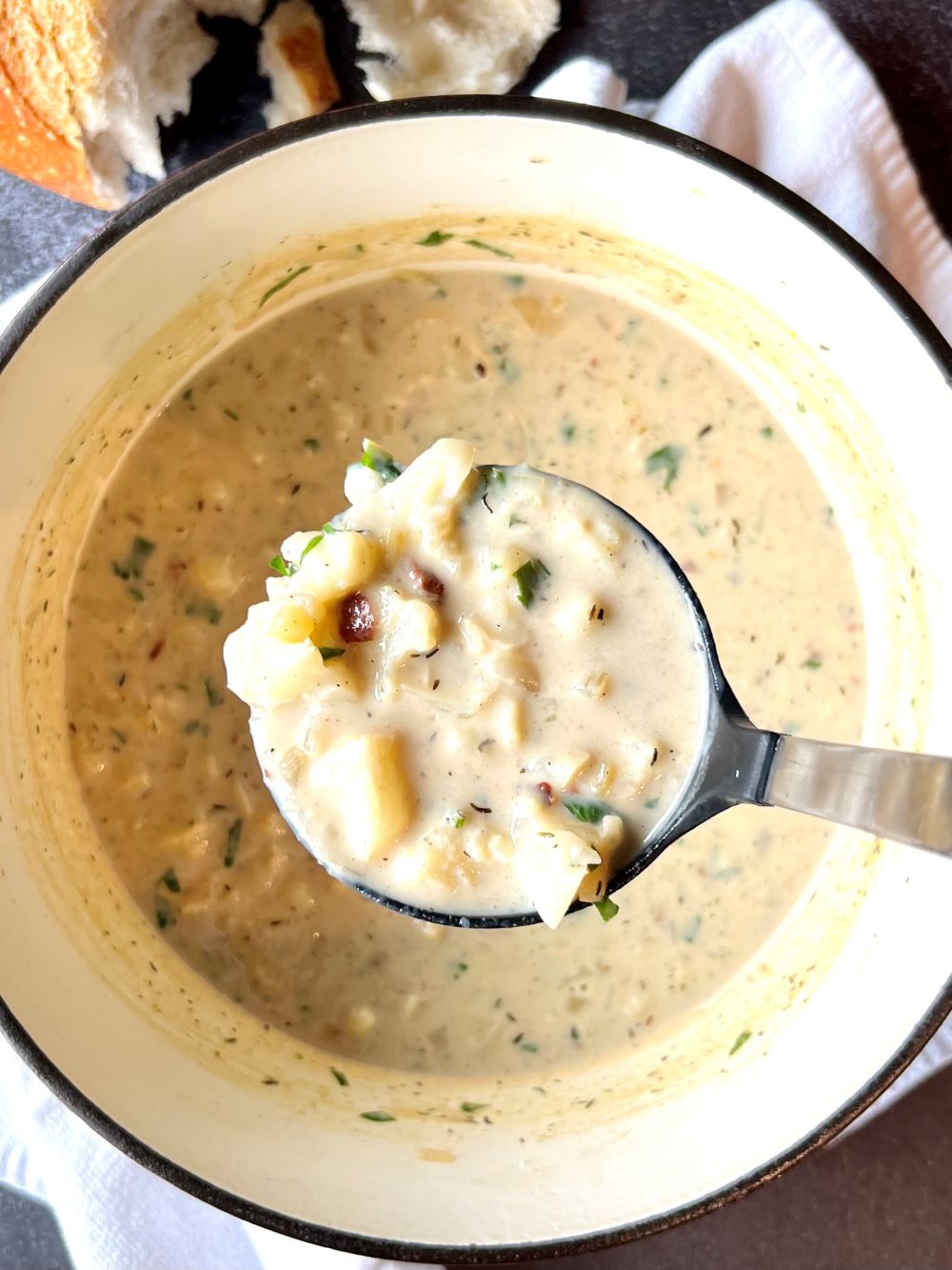 A soup pot with cauliflower soup, no toppings. 