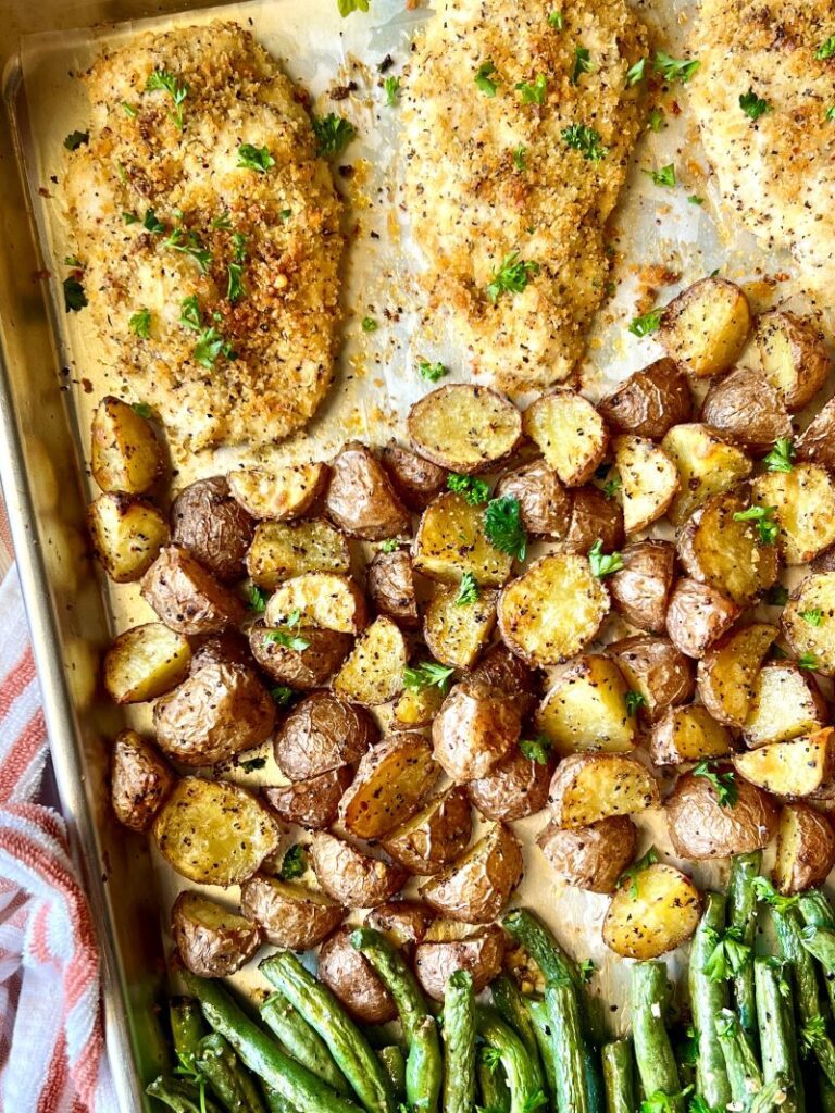 Crispy parmesan Chicken sheet pan meal with chicken, potatoes, and green beans.