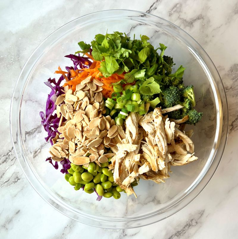All salad ingredients in a large bowl.
