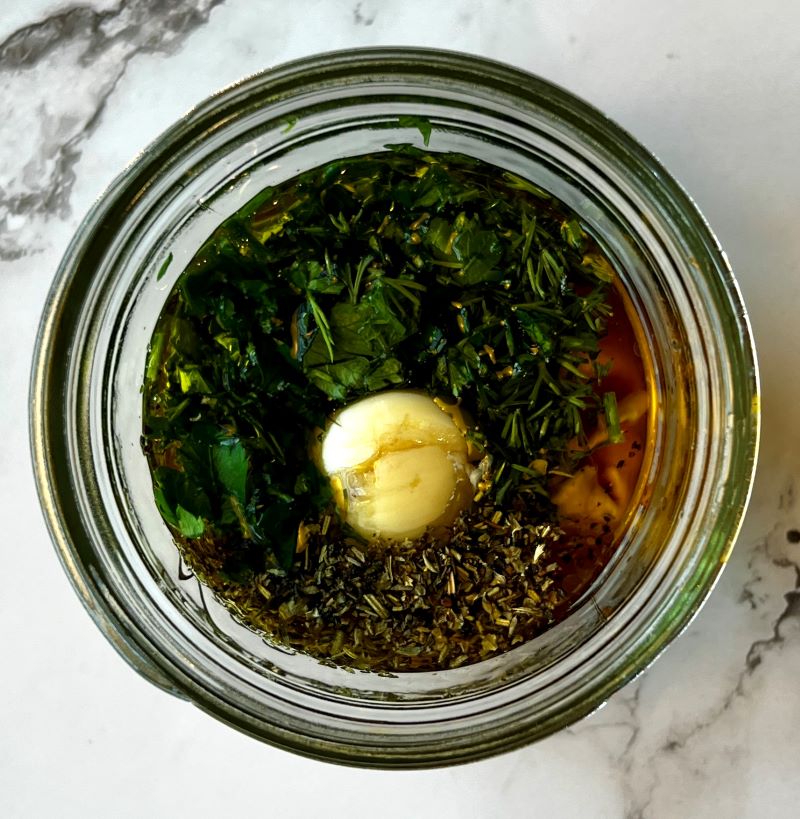 Dressing ingredients mixed in a mason jar.