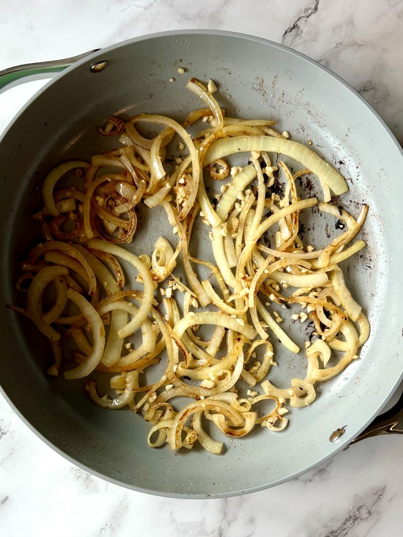 Onions and garlic browned in a large skillet.