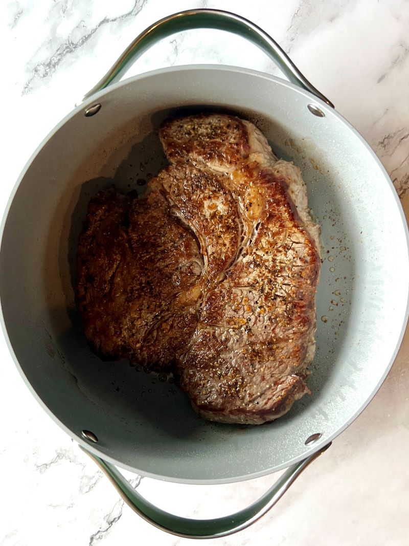 Chuck roast seared on both sides  with salt and pepper in a large pot. 