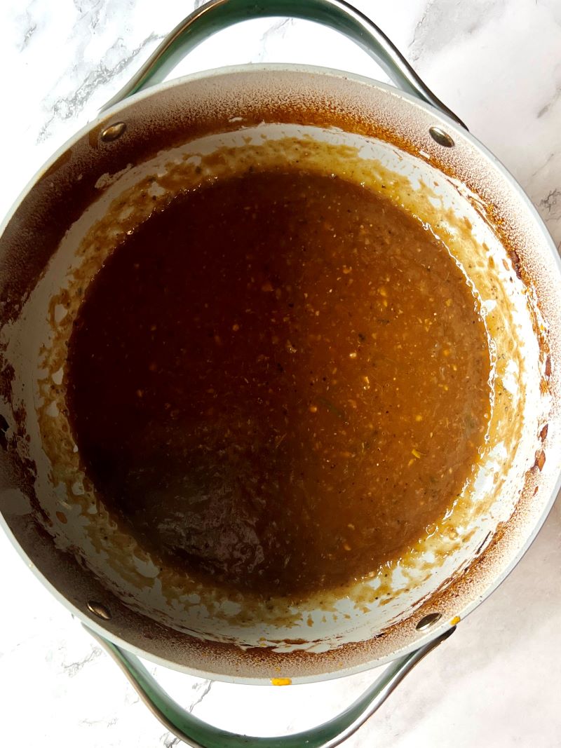 Gravy for braised pot roast with mushrooms and carrots. 