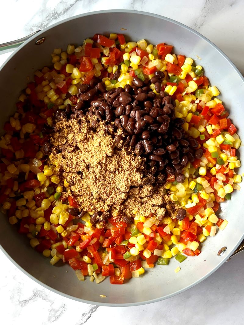 Add taco seasoning and black beans.