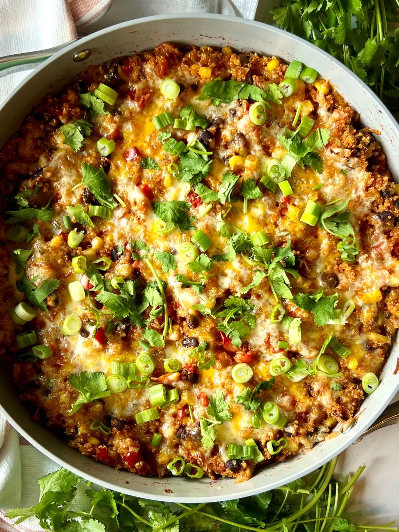 Add more cheese and bake until bubbly. Top with green onion and cilantro. 