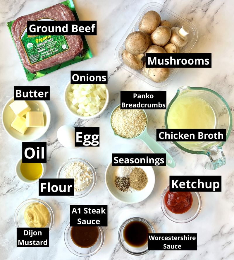 Ingredients for Salisbury steak meatballs. Ground beef, onions, mushrooms, egg, panko breadcrumbs, salt pepper, umami seasoning blend, A1 steak sauce, ketchup, Worcestershire sauce, Dijon mustard, oil, butter, chicken broth, flour