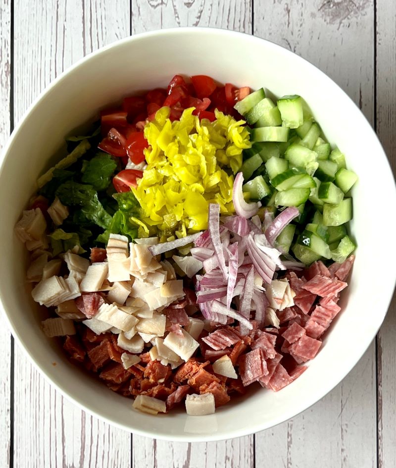 Chop salad ingredients prepared in a medium bowl 