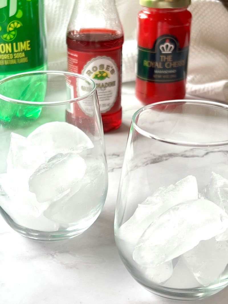 Two clear glasses filled with ice