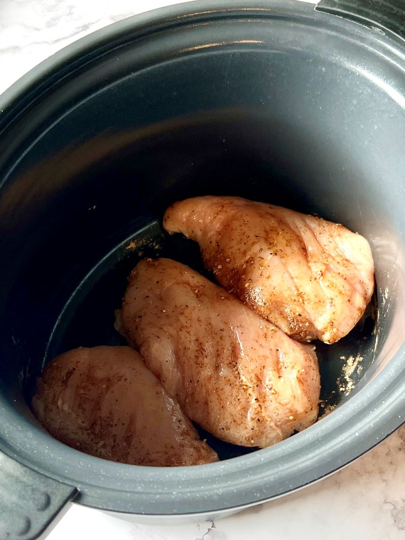 Chicken in the slow cooker with fajita seasoning.