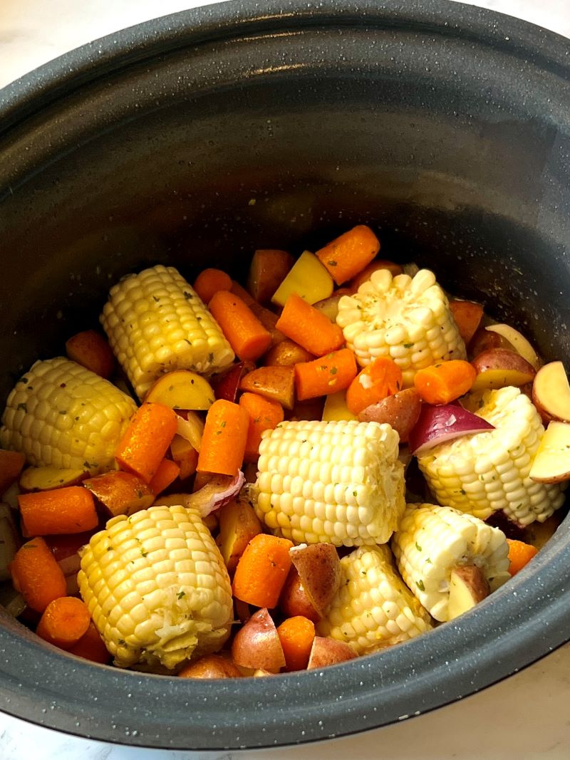 Veggies layered in the slow cooker.