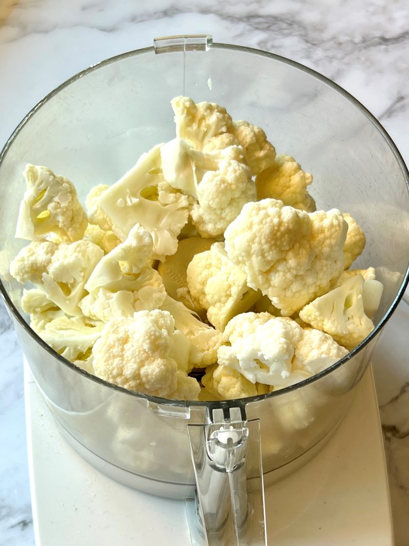 Cauliflower florets in a food processor.