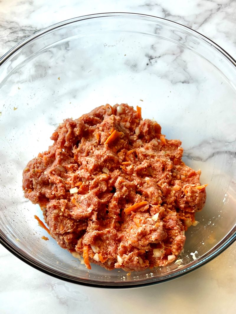 Meatloaf mixture combined in a bowl.