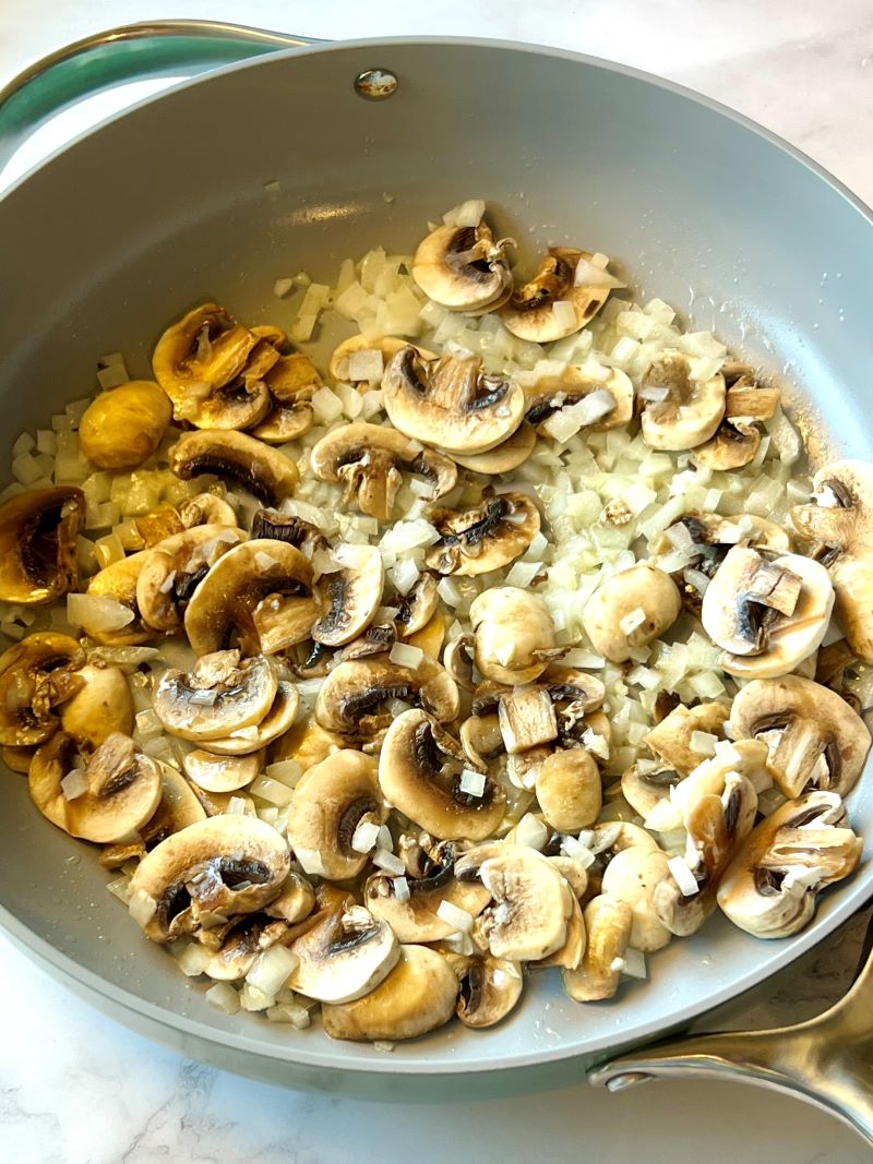 Sautéed mushrooms, onions, and garlic with butter in a large skillet. 