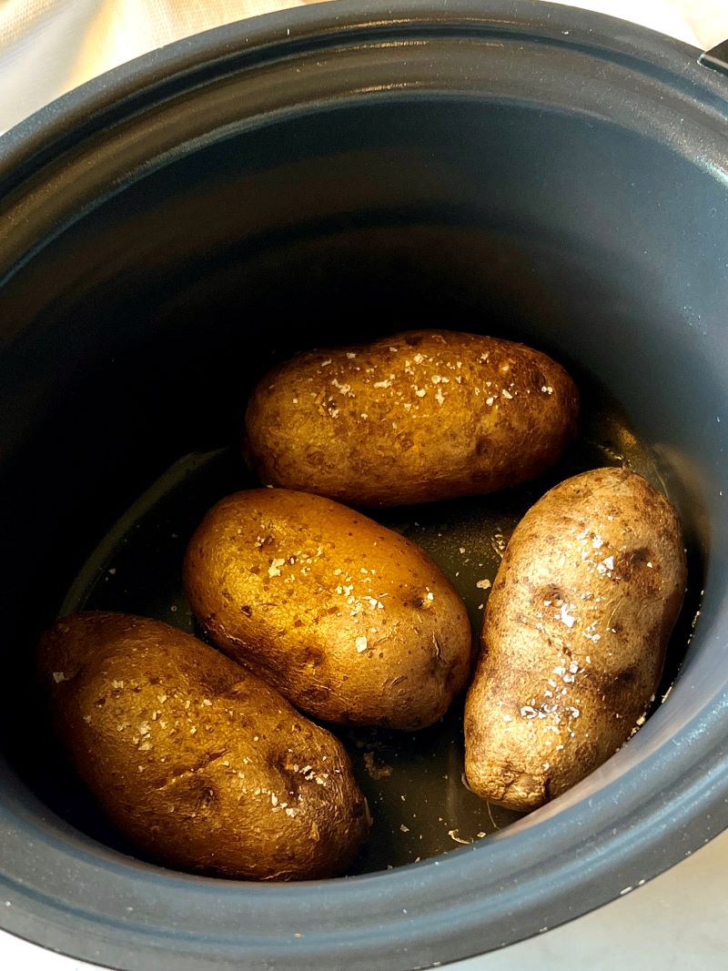 Cooked baked potatoes in a slow cooker