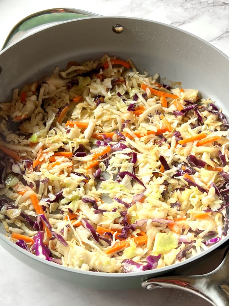 Sautéed coleslaw mix and garlic in a large skillet. 
