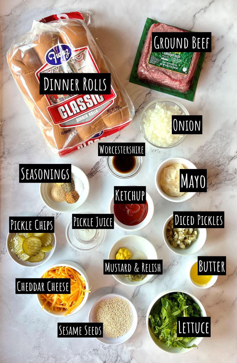 Ingredients displayed for big mac sliders. Ground beef, dinner rolls, onion, Worcestershire, seasonings, mayo, ketchup, pickle juice, pickle chips, chopped dill pickles, mustard, sweet relish, butter, cheddar cheese, sesame seeds, and lettuce. 