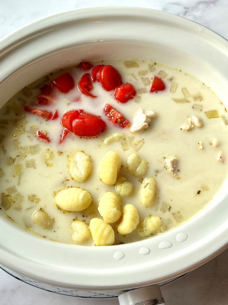 Gnocchi, tomatoes, half and half, and cornstarch combined in slow cooker.