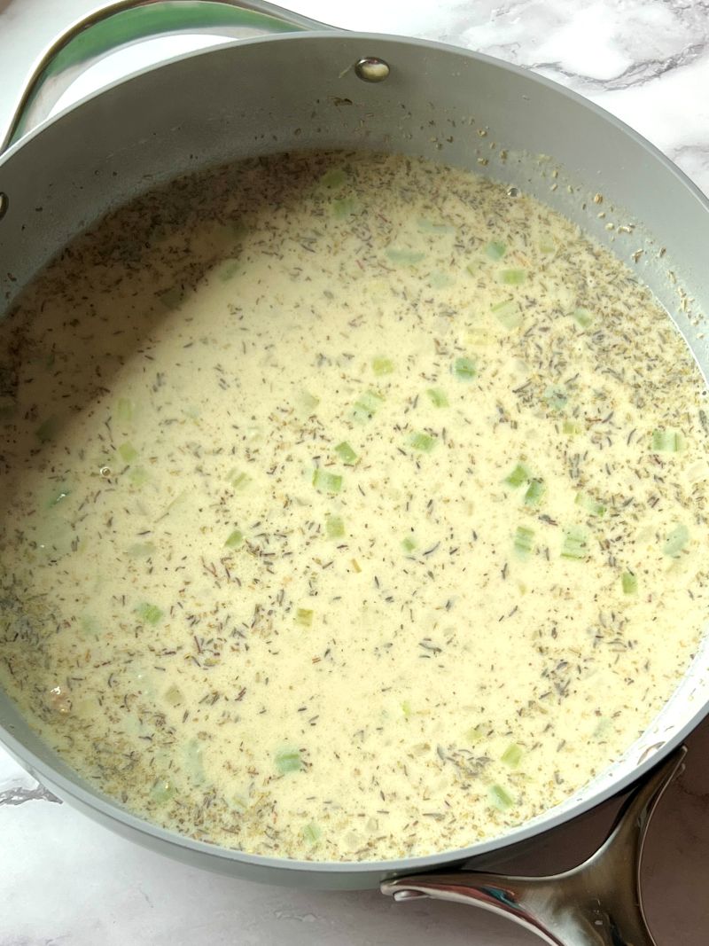 Chicken broth and milk added to the flour mixture to make a cream sauce. 