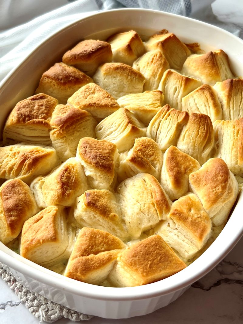 Cooked chicken pot pie casserole with golden brown biscuits.