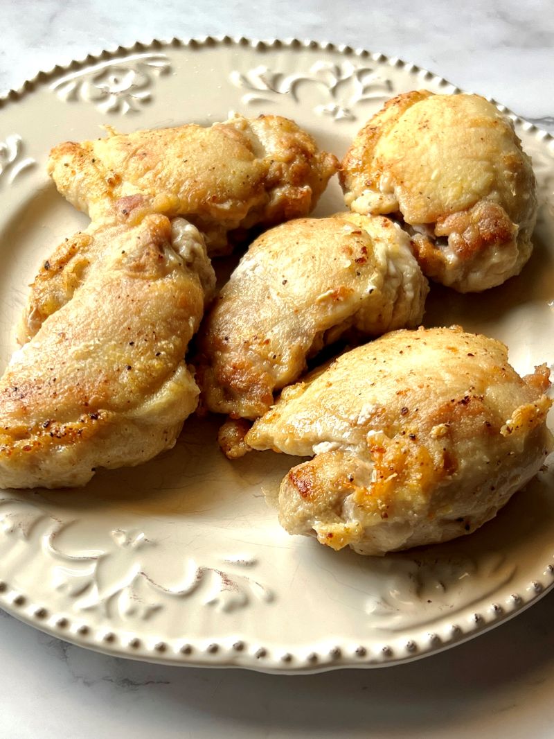 Chicken thighs browned.