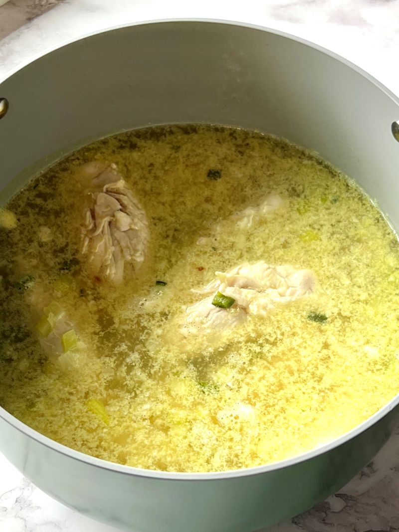 Chicken broth added to the pot.