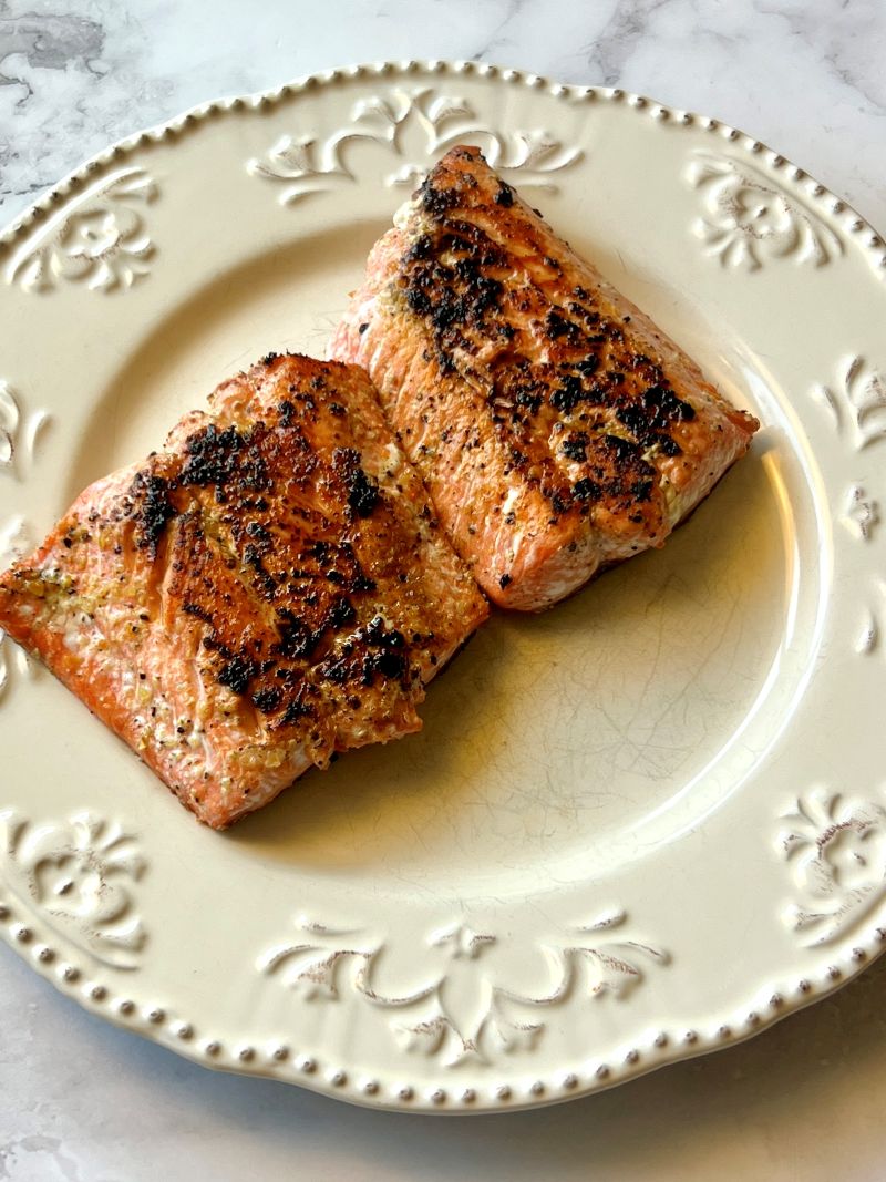 Salmon seared and cooked on a plate. 