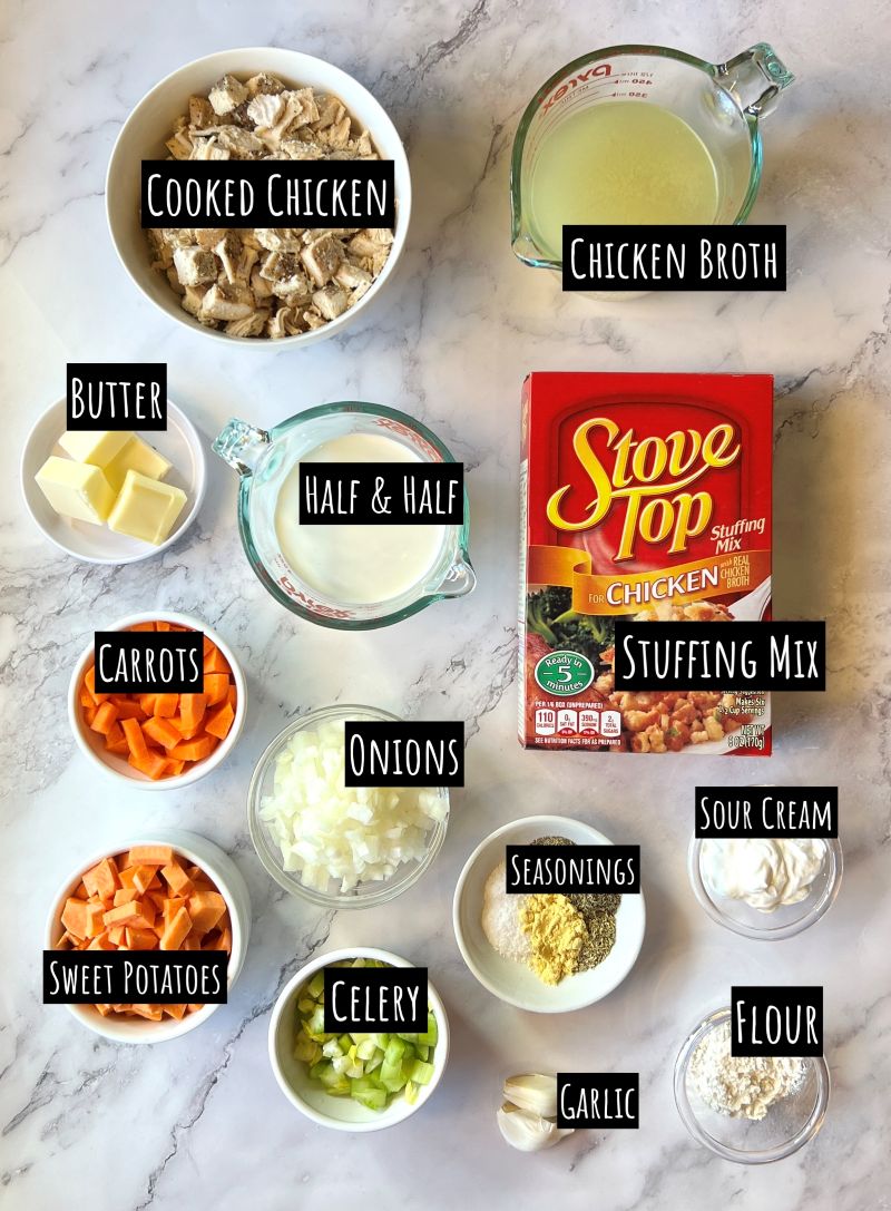 Ingredients displayed for chicken stuffing casserole. Cooked chicken, chicken broth, butter, half and half, carrots, onions, sweet potatoes, sour cream, seasonings, celery, garlic, and flour.