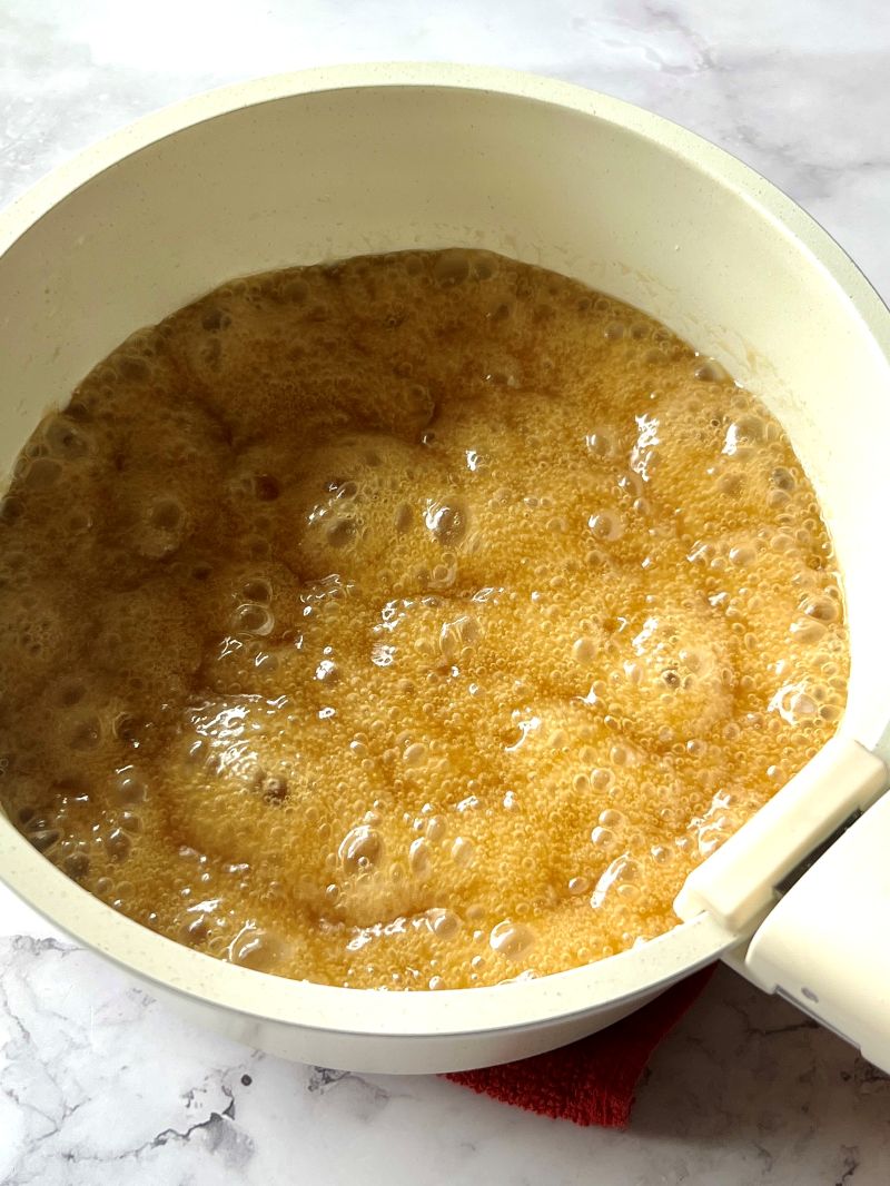 Butter melted with brown sugar, corn syrup, vanilla and maple extract, baking soda, and salt.