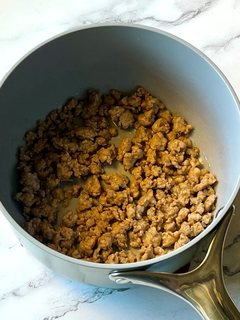 Italian sausage cooked in a soup pot