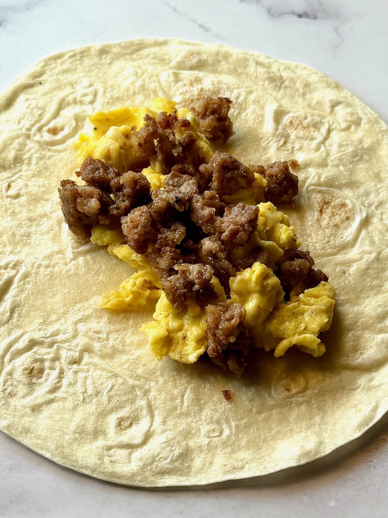 Tortilla filled with eggs and sausage.