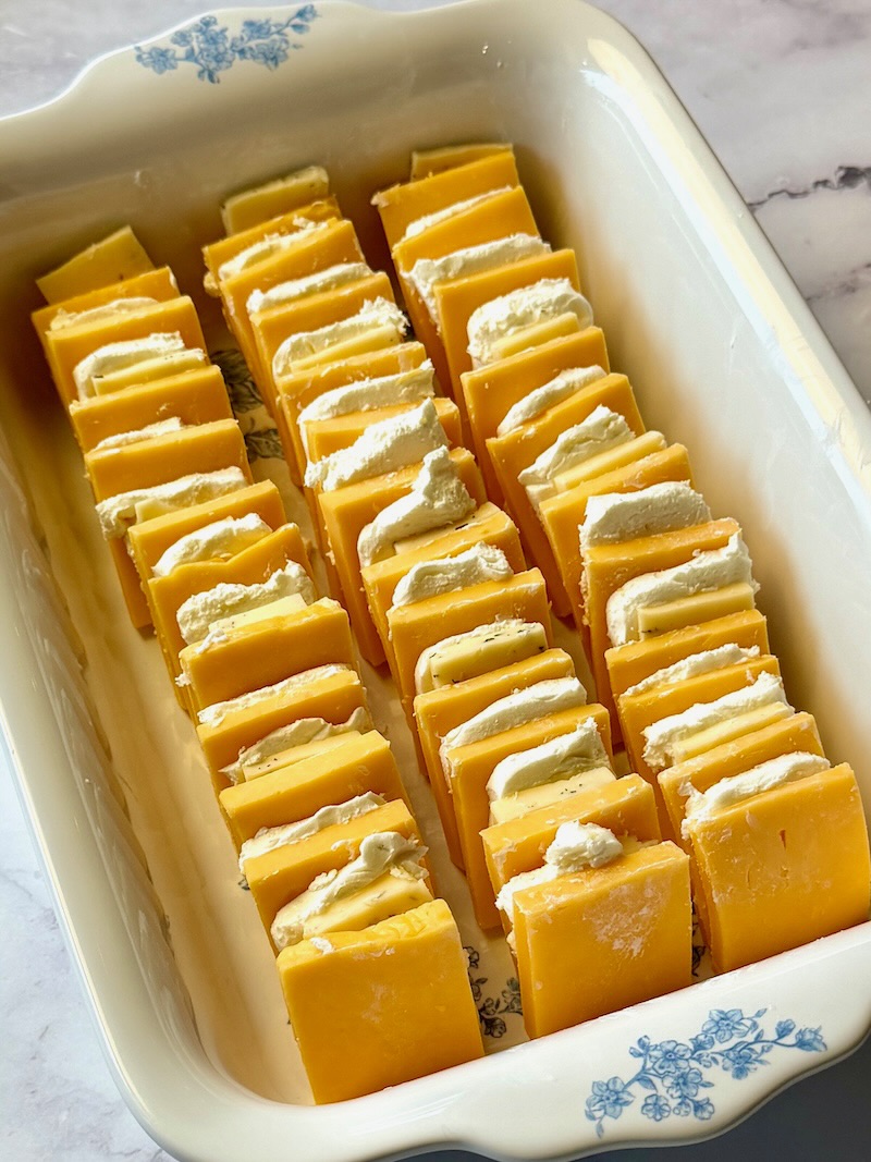 Cheese layered in a shallow dish.