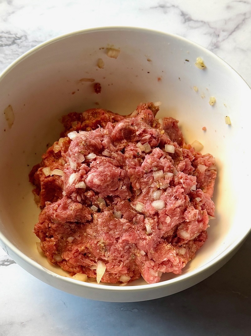 meatball mixture combined in a medium bowl.