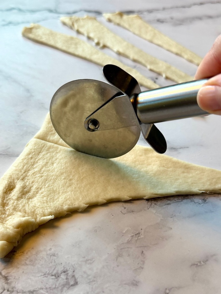Crescent dough triangles cut in thirds.