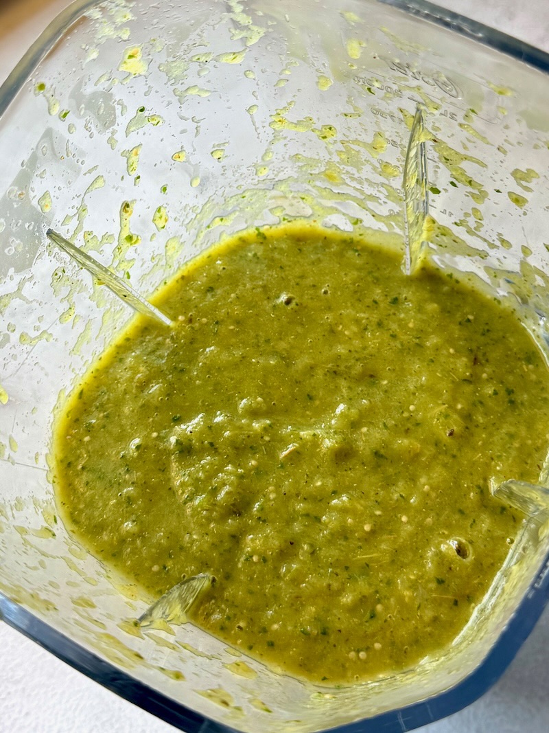 Roasted peppers and tomatillos blended in a blender until smooth with cilantro, spices, green chilis, lime juice, and chicken broth.