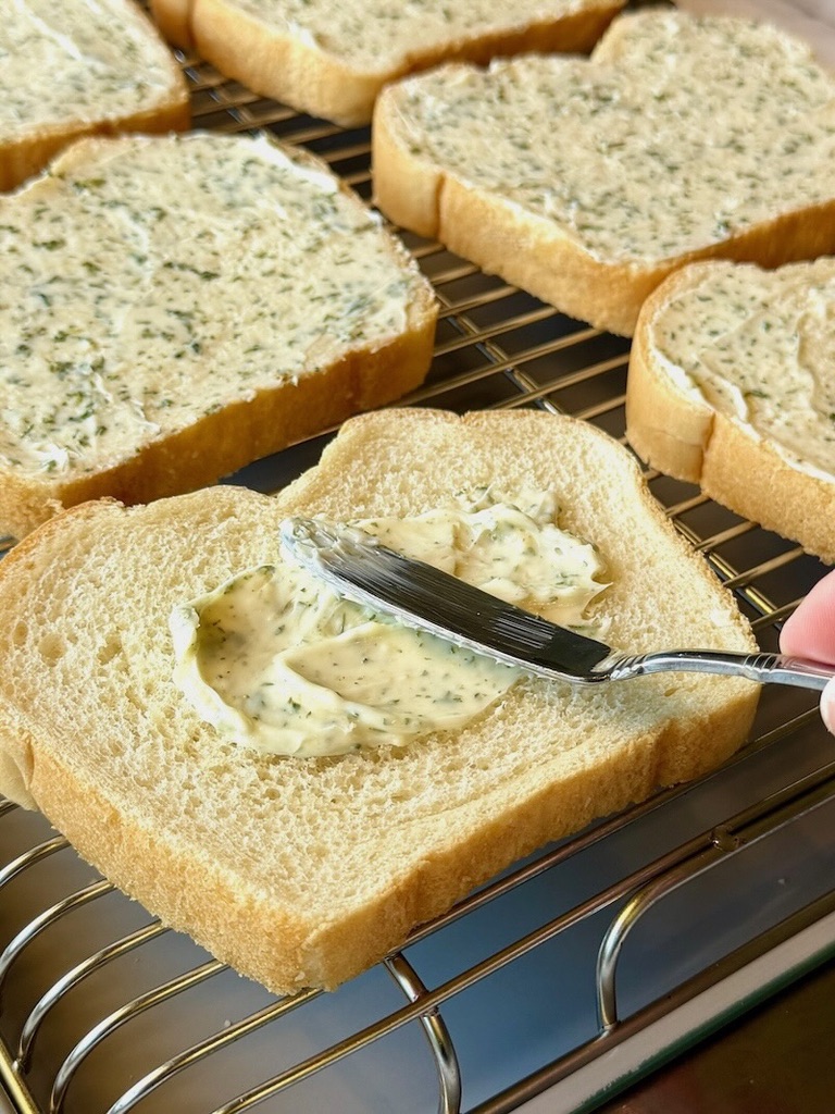 butter mixture spread on bread slices. 