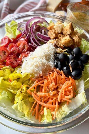 Olive garden salad ingredients in a serving bowl