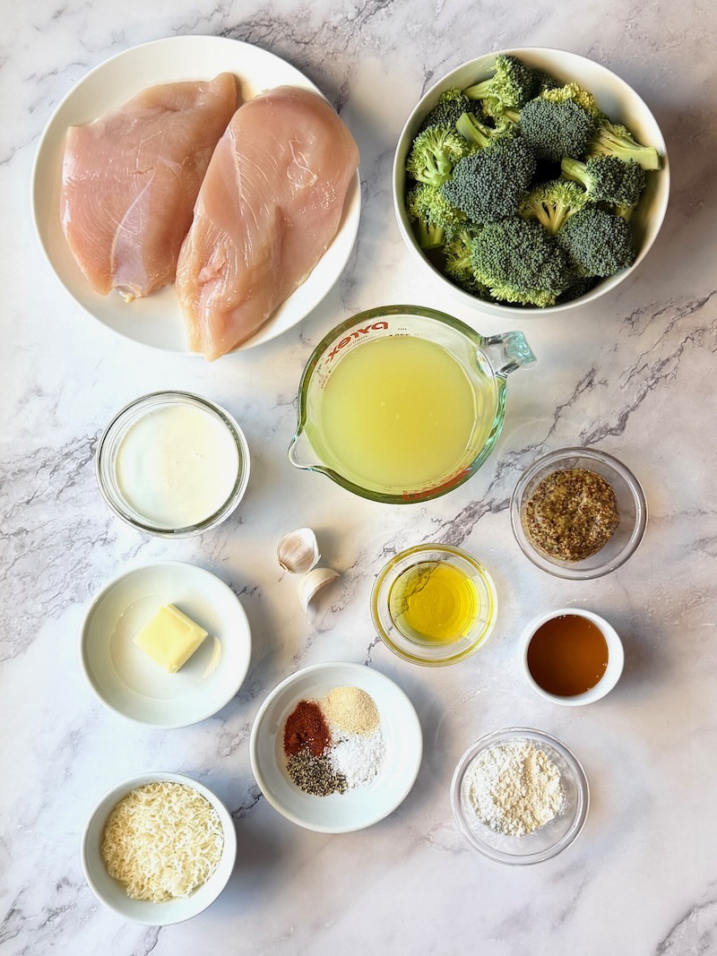 Ingredients listed for honey mustard chicken and broccoli. Chicken breasts, fresh broccoli, chicken broth, heavy cream, garlic, whole grain mustard, honey, olive oil, butter, flour, parmesan cheese, seasonings.