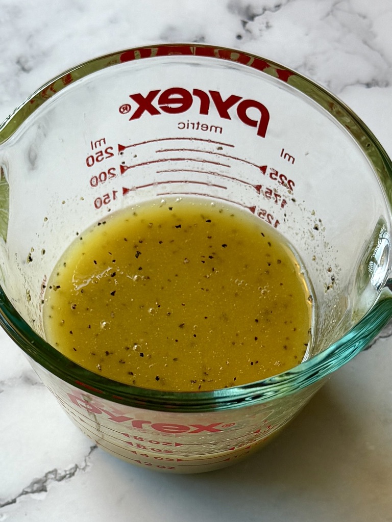 Dressing ingredients combined in a small mixing bowl