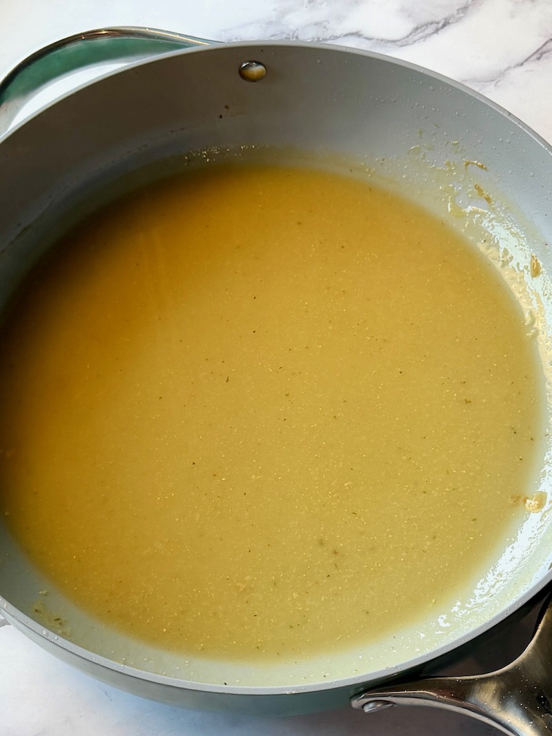 chicken broth added to the skillet and thickened