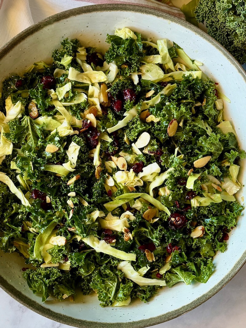 Easy kale crunch salad assembled in a large serving bowl.