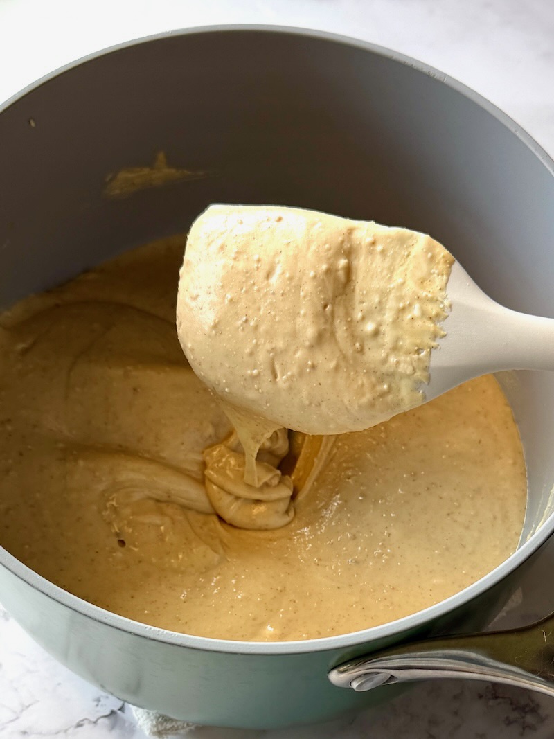 white chocolate chips, peanut butter, and vanilla extract in a saucepan melted smooth.