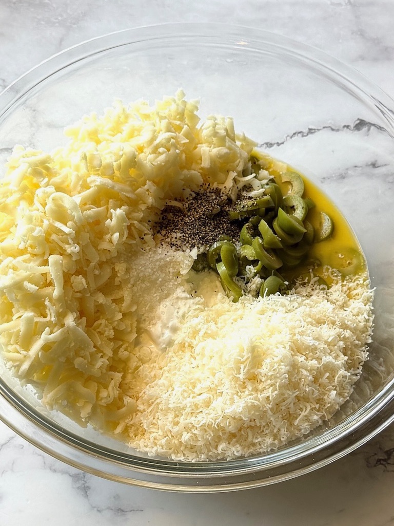 Sour cream sauce ingredients in a mixing bowl.
