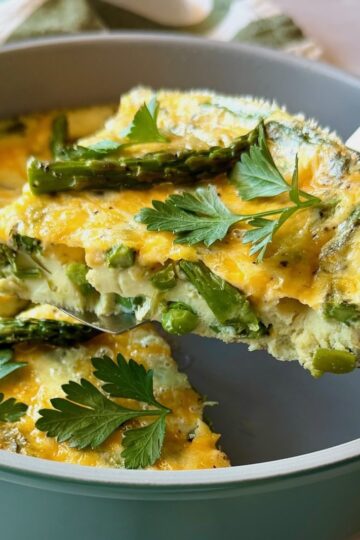 Spring frittata cut in a triangle wedge.
