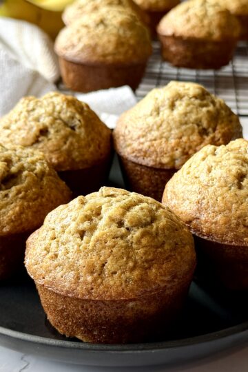 easy fluffy banana muffins on a plate.