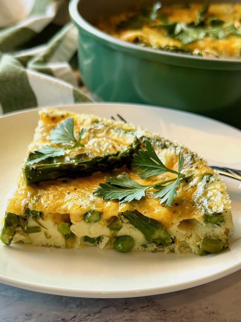 one slice of spring frittata on a plate.