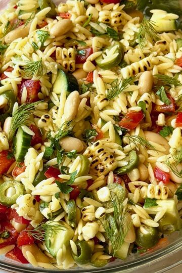 Summer glow orzo salad in a serving bowl.